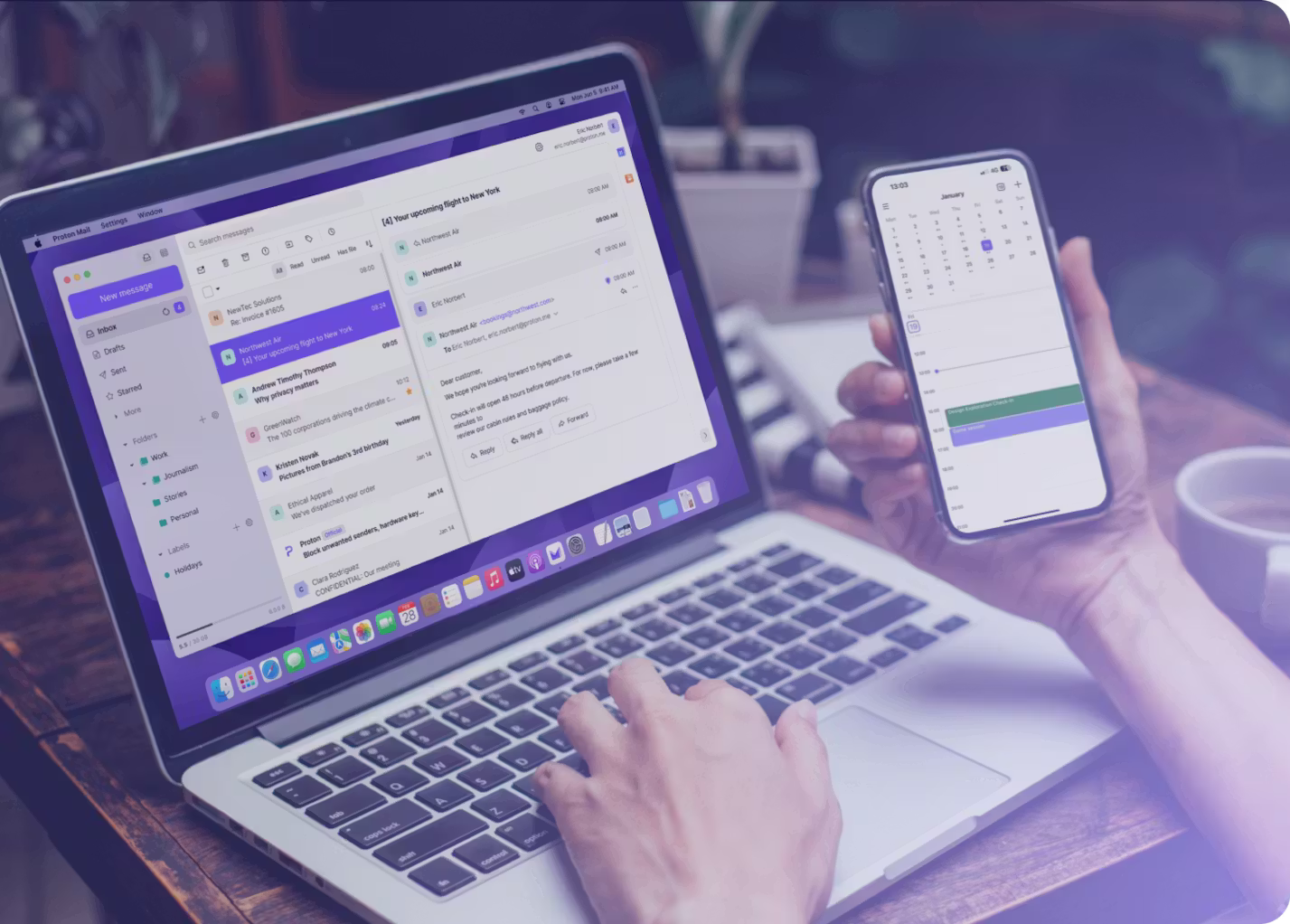 Marketing image of someone checking their Proton Mail on a Mac and Proton Calendar on an iPhone